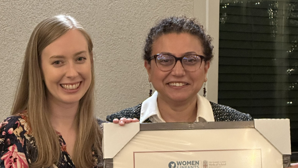 photo of Dr. Gogcu presenting diploma to Dr. Sagaser