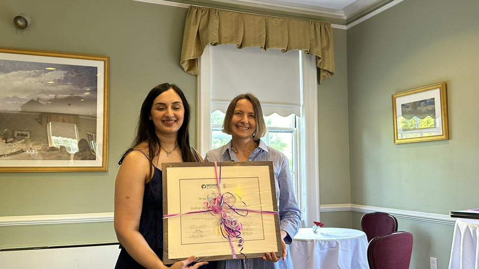 photo of Dr. Lechner presenting diploma to Dr. Batta