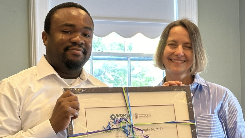 photo of Dr. Lechner presenting diploma to Dr. Avungbeto 