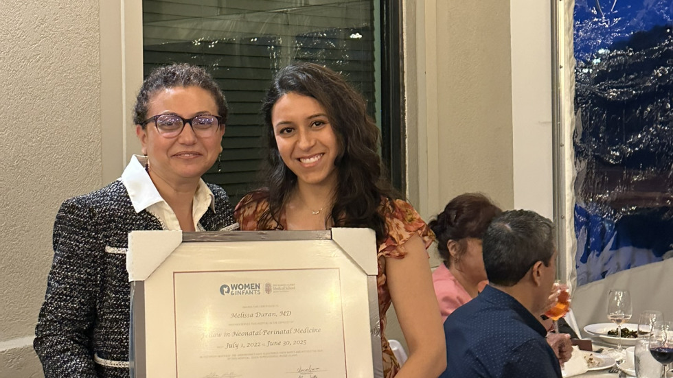 photo of Dr. Gogcu presenting diploma to Dr. Duran 